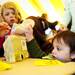Ann Arbor resident Ronan Nayak-Young, 2, grabs a crayon for coloring during Earth Day at the Leslie Science and nature Center on Sunday, April 21. AnnArbor.com I Daniel Brenner
